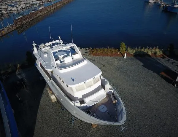 Slide: The Image of 2005 Inace Trawler yacht on dry dock near marina, aerial view. - 97