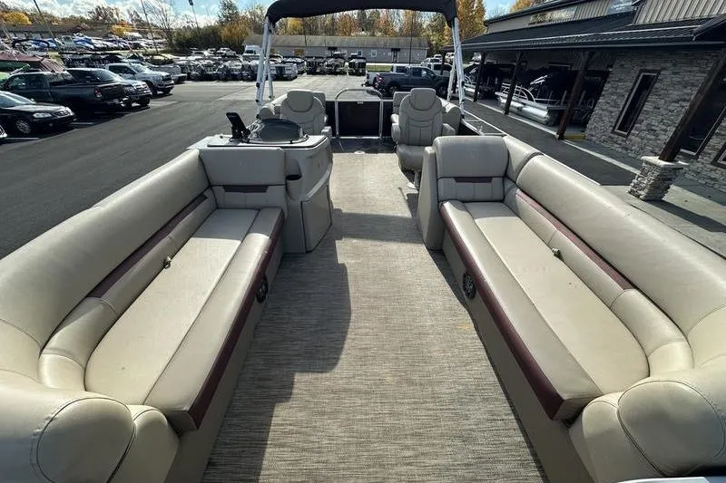 Slide: The Image of 2020 Sweetwater SW 2286 SB pontoon boat interior with spacious seating and helm. - 7