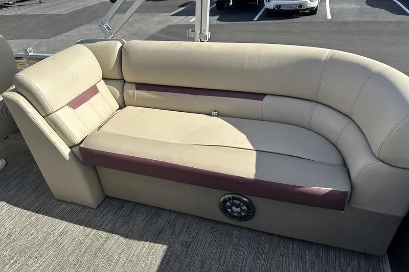 Slide: The Image of 2020 Sweetwater SW 2286 SB boat interior with beige and maroon seating. - 19