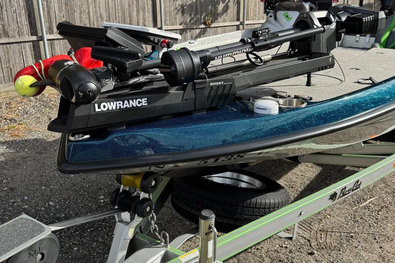 Slide: The Image of 2021 Bass Cat Cougar FTD boat with Lowrance equipment on trailer. - 10