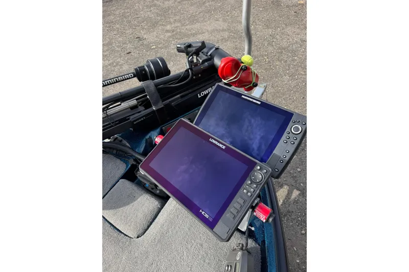 Slide: The Image of 2021 Bass Cat Cougar FTD boat with Humminbird and Lowrance fish finders on deck. - 11