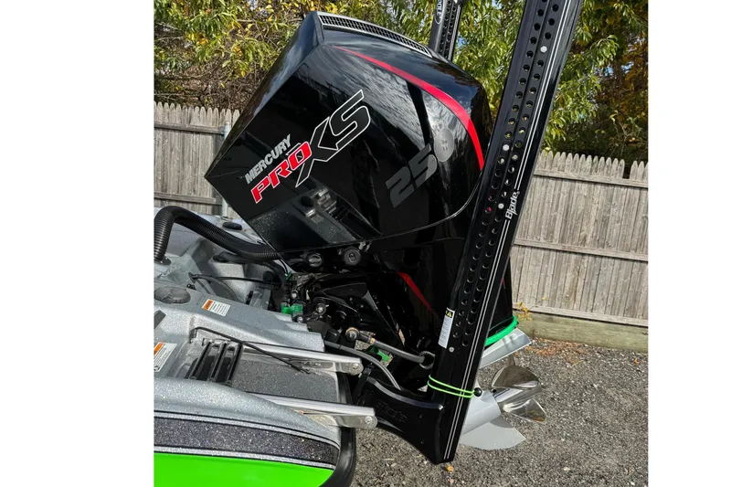 Slide: The Image of 2021 Bass Cat Cougar FTD with Mercury Pro XS engine, parked outdoors. - 5