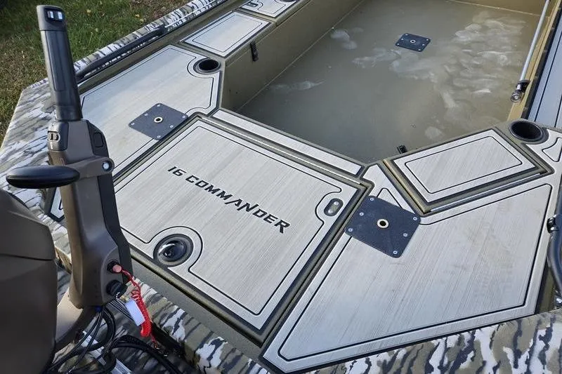 Slide: The Image of Avid 16 Commander 2025 boat interior with camo design and storage compartments. - 6