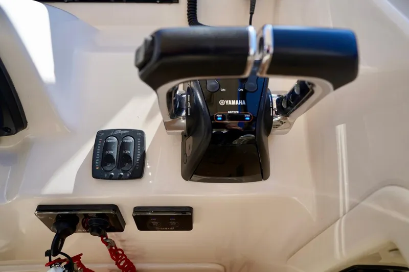 Slide: The Image of Control panel of 2015 Grady-White Freedom 307 boat with Yamaha throttle. - 17