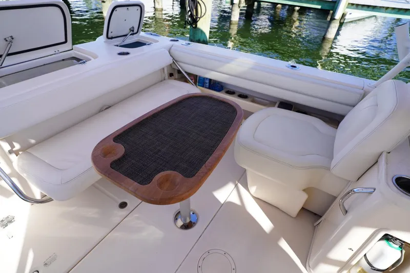 Slide: The Image of Interior of 2015 Grady-White Freedom 307 boat with seating and table. - 25