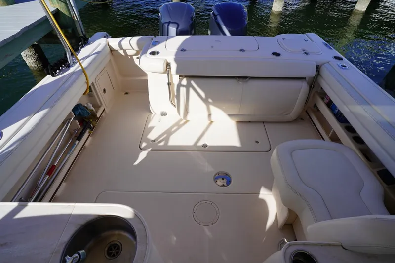 Slide: The Image of 2015 Grady-White Freedom 307 boat interior with seating and storage compartments. - 33