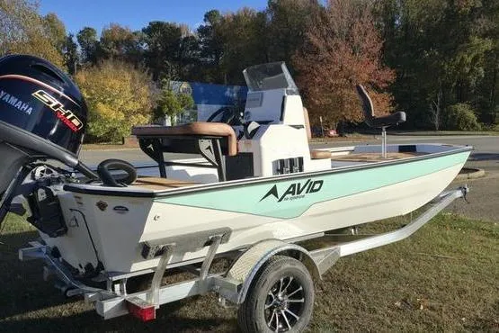 Slide: The Image of 2026 Avid 18 Rogue CC boat on trailer with Yamaha engine, parked outdoors. - 8
