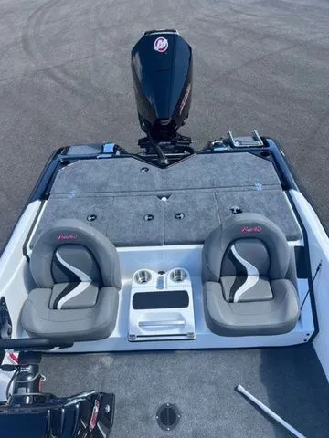 Slide: The Image of 2026 Bass Cat Pantera Classic boat interior with dual seats and motor, showcasing sleek design. - 4