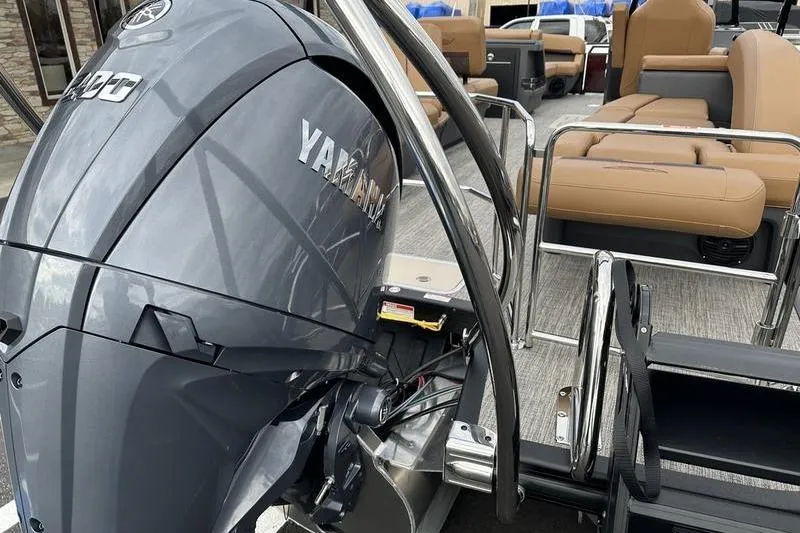 Slide: The Image of 2026 Bennington M Quad Bench 24 MSL with Yamaha outboard motor, featuring spacious seating. - 10