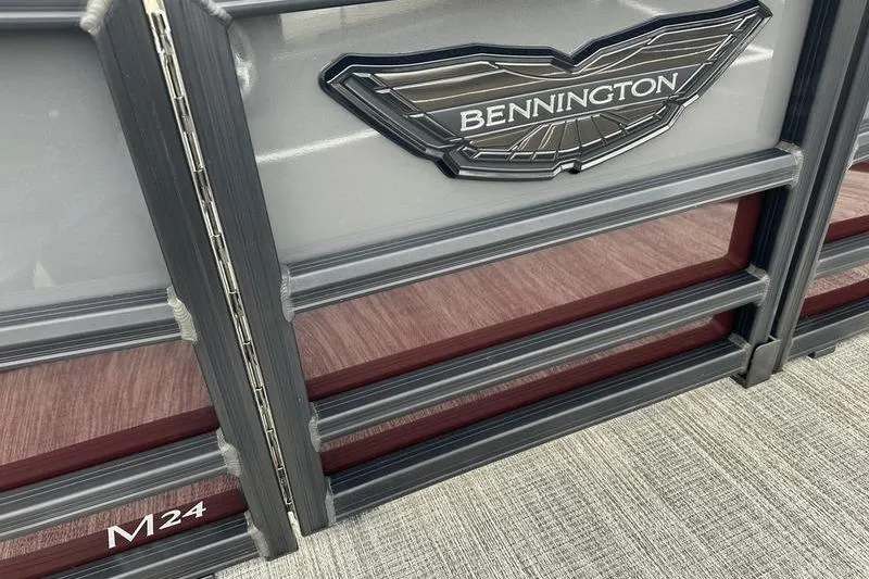 Slide: The Image of 2026 Bennington M Quad Bench 24 MSL pontoon boat with sleek design details. - 13