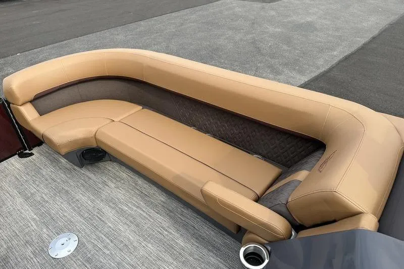 Slide: The Image of 2026 Bennington M Quad Bench 24 MSL with tan upholstery on a boat deck. - 24