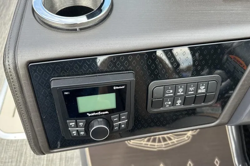 Slide: The Image of Control panel of 2026 Bennington M Quad Bench 24 MSL with audio system and switches. - 32