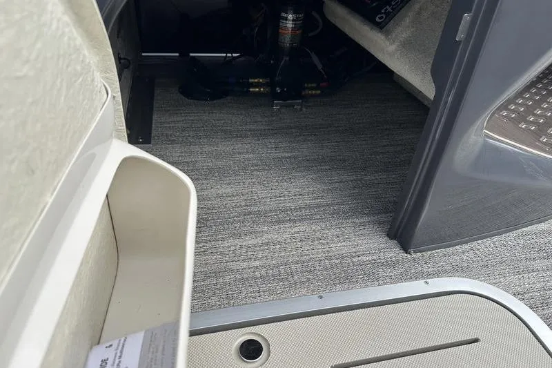 Slide: The Image of Interior view of 2026 Bennington M Quad Bench 24 MSL with carpeted flooring. - 33