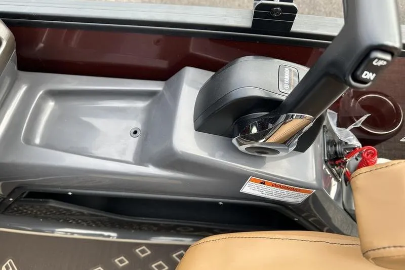 Slide: The Image of Control panel of 2026 Bennington M Quad Bench 24 MSL with throttle lever. - 34