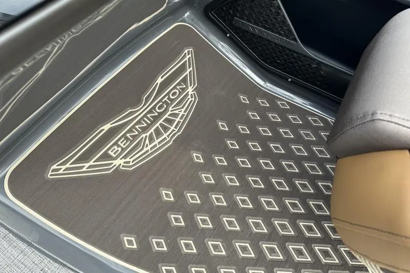 Slide: The Image of Bennington M Quad Bench 24 MSL 2026 floor mat with logo and geometric pattern. - 35