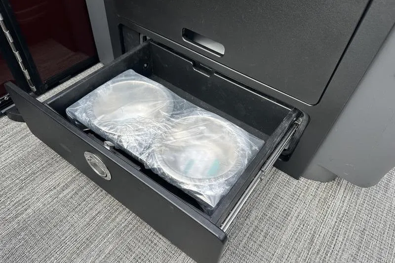Slide: The Image of Storage drawer with packaged items in a 2026 Bennington M Quad Bench 24 MSL. - 38