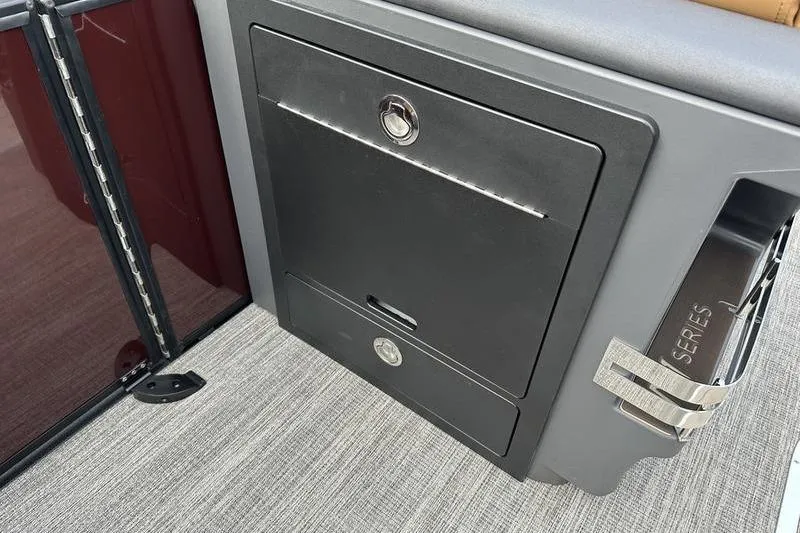 Slide: The Image of 2026 Bennington M Quad Bench 24 MSL interior storage compartment with sleek design. - 43