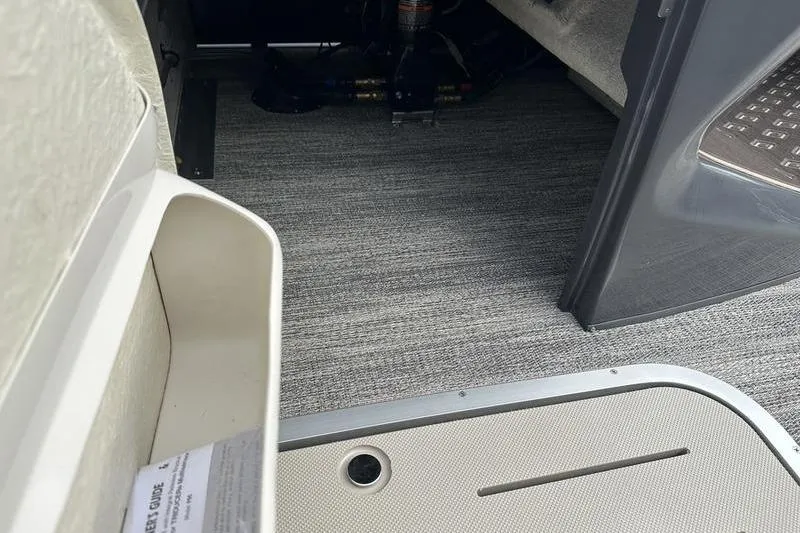 Slide: The Image of Interior view of 2026 Bennington M Quad Bench 24 MSL with carpeted flooring. - 44