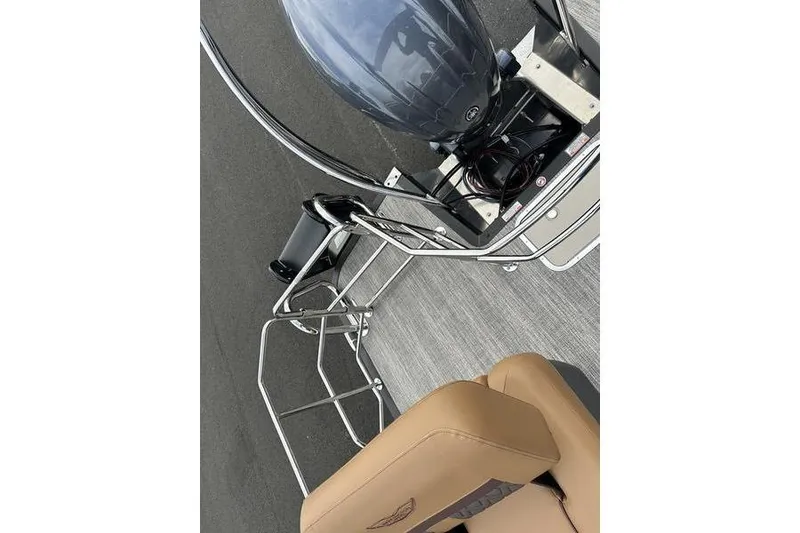 Slide: The Image of 2026 Bennington M Quad Bench 24 MSL boat with tan seating and sleek design. - 53