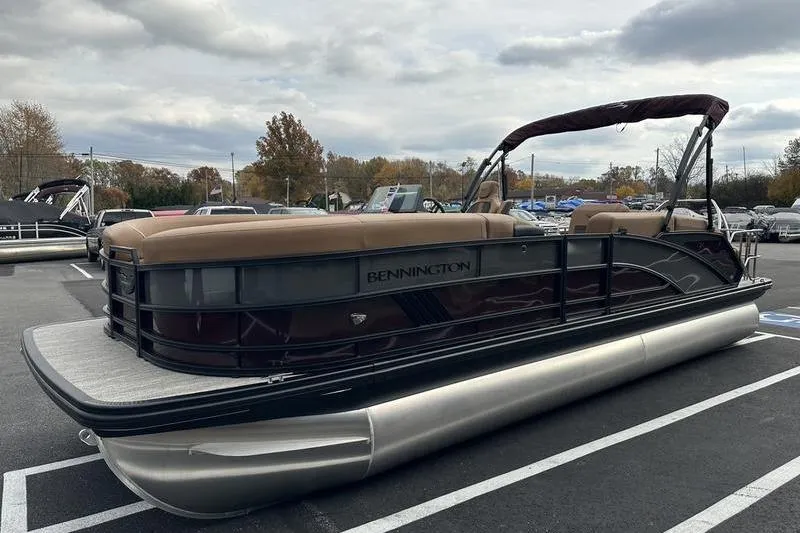 Slide: The Image of 2026 Bennington M Quad Bench 24 MSL pontoon boat in parking lot. - 9