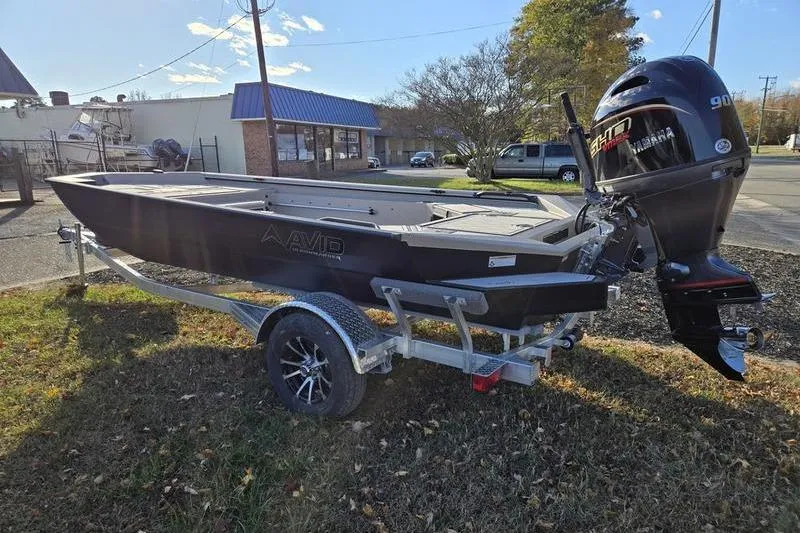 Slide: The Image of 2026 Avid 18 Commander boat interior with spacious deck and storage compartments. - 10