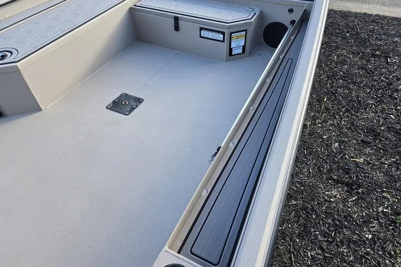 Slide: The Image of 2026 Avid 18 Commander boat interior with storage compartments and seating. - 8