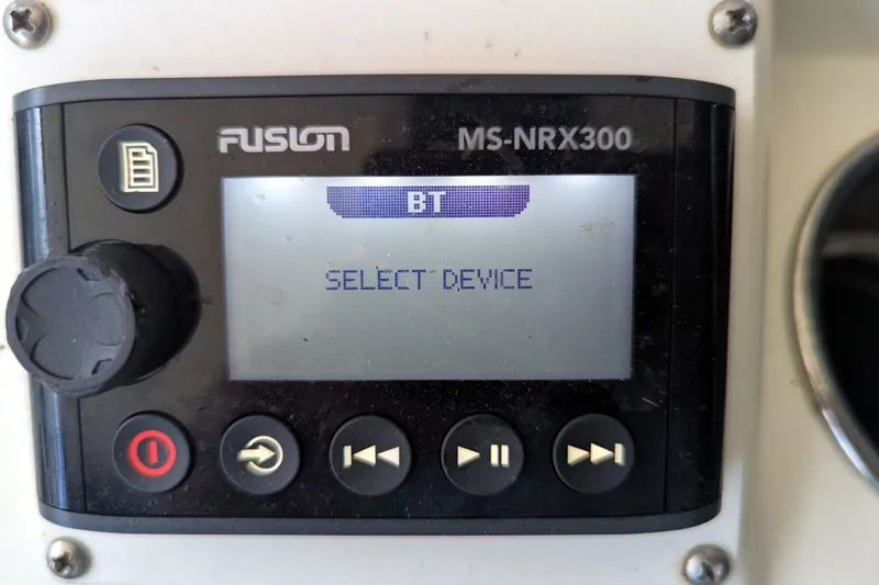 Slide: The Image of Fusion MS-NRX300 audio control panel on 2013 Cobia 296 Center Console boat. - 13