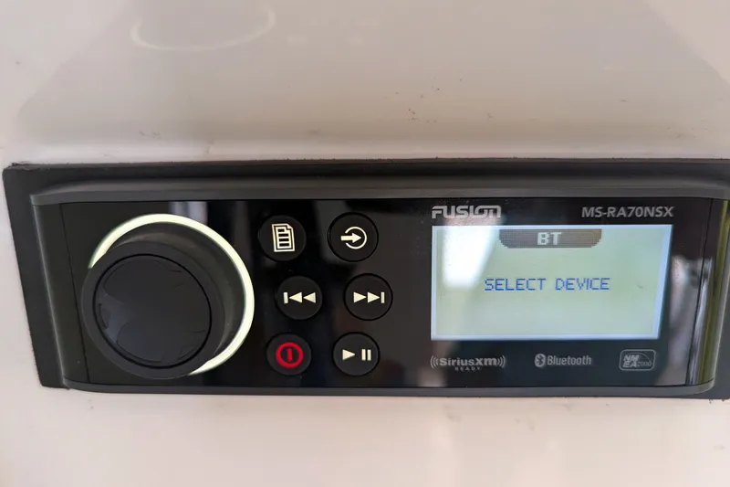Slide: The Image of Fusion MS-RA70NSX stereo system on 2013 Cobia 296 Center Console boat, displaying "Select Device." - 14