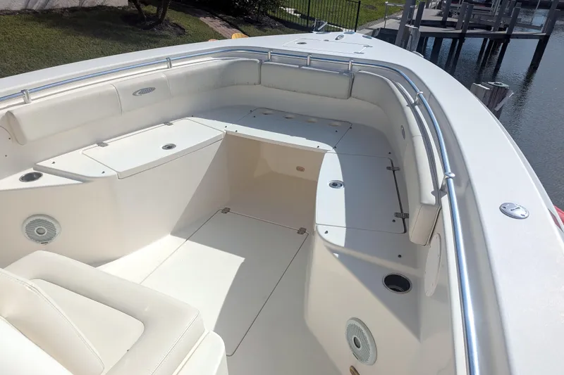 Slide: The Image of 2013 Cobia 296 Center Console boat interior with spacious seating and storage. - 17