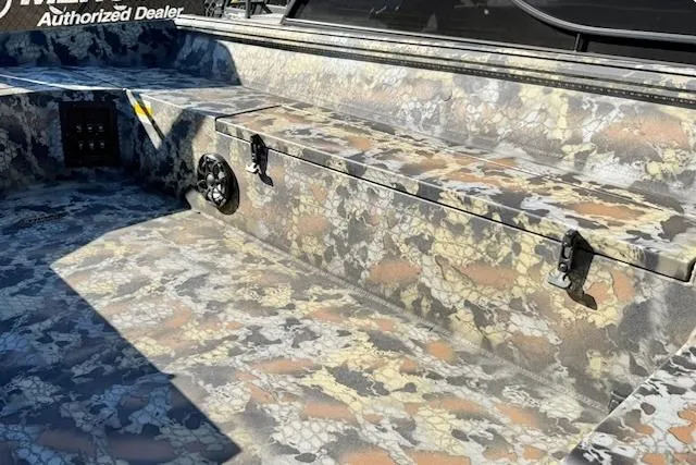 Slide: The Image of 2026 Thor TIMBER HAMMER 1754 boat interior with camouflage design and storage compartment. - 4