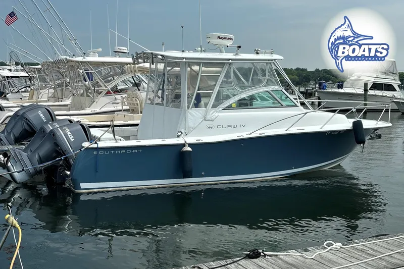 The Image of 2008 Southport 28 Express boat docked with twin Yamaha engines, marina background. - 0