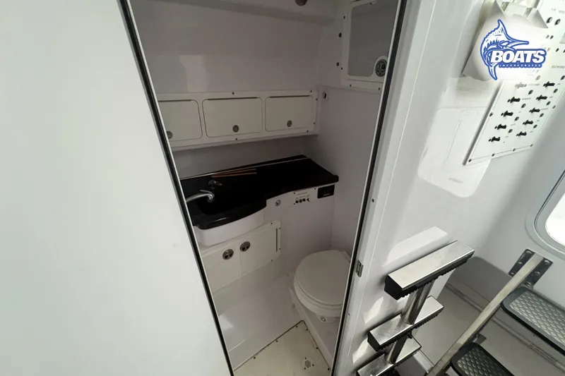 Slide: The Image of Interior cabin of 2008 Southport 28 Express boat, featuring sleek design and modern amenities. - 12