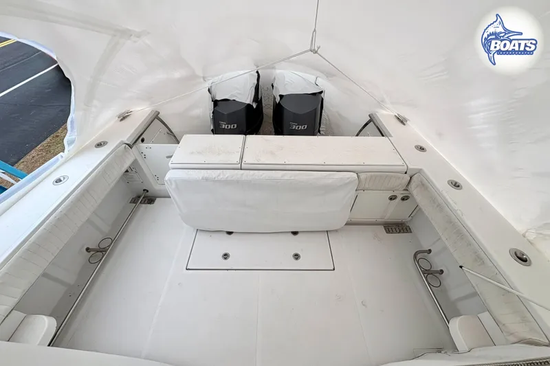 Slide: The Image of Interior cabin of 2008 Southport 28 Express boat with cushioned seating and pillows. - 13