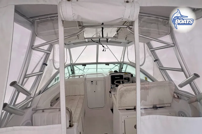 Slide: The Image of 2008 Southport 28 Express boat docked by the water, featuring sleek design and modern amenities. - 4