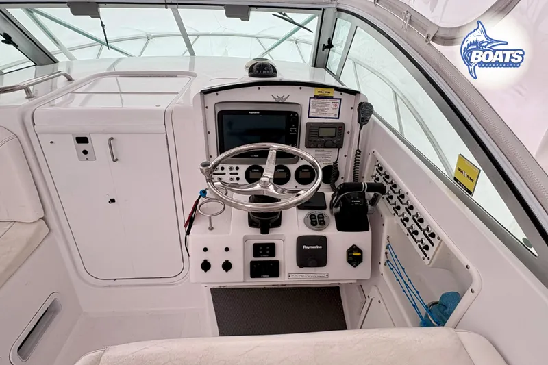 Slide: The Image of 2008 Southport 28 Express boat interior with helm, seating, and navigation equipment. - 7