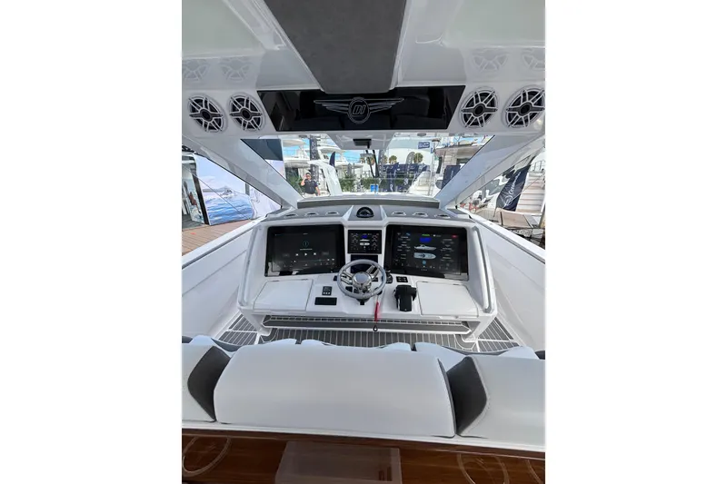 Slide: The Image of Luxury boat interior of 2026 Deep Impact 499 Sport, featuring sleek design and wooden accents. - 21