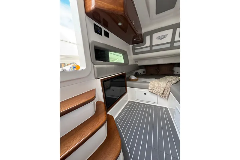 Slide: The Image of Top view of 2026 Deep Impact 499 Sport Luxury Edition boat with five outboard engines. - 26