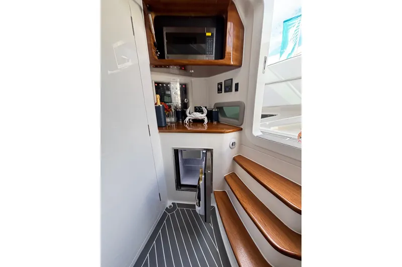 Slide: The Image of Aerial view of 2026 Deep Impact 499 Sport Luxury Edition yacht on open water. - 28