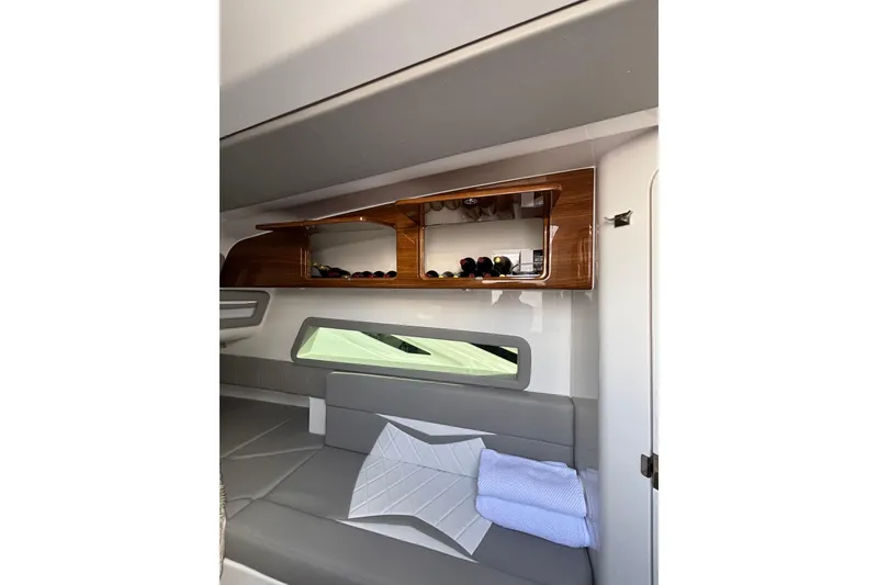 Slide: The Image of Luxury 2026 Deep Impact 499 Sport boat cruising near city skyline. - 31