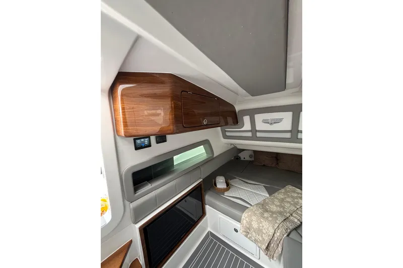 Slide: The Image of Luxury 2026 Deep Impact 499 Sport boat cruising on open ocean waters. - 32