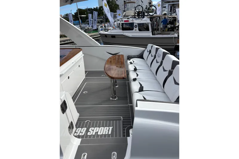 Slide: The Image of 2026 Deep Impact 499 Sport Luxury Edition cruising on open water. - 35