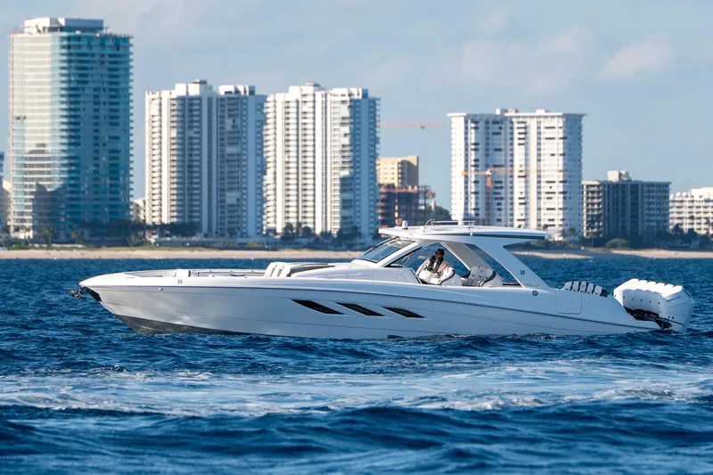 Slide: The Image of Luxury yacht Deep Impact 499 Sport, 2026 model, cruising near city skyline. - 46