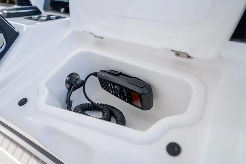 Slide: The Image of Storage compartment with radio in 2026 Deep Impact 499 Sport Luxury Edition boat. - 48