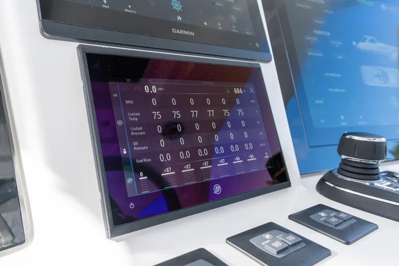Slide: The Image of Control panel of 2026 Deep Impact 499 Sport Luxury Edition boat, displaying engine metrics. - 51