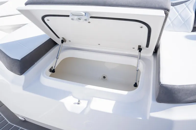 Slide: The Image of Open storage compartment on 2026 Deep Impact 499 Sport Luxury Edition boat. - 59