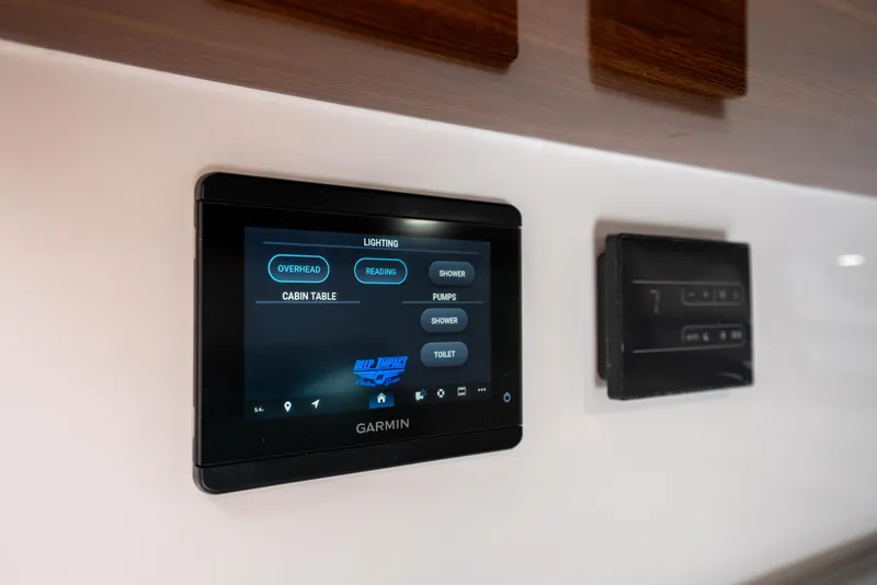 Slide: The Image of Touchscreen control panel in 2026 Deep Impact 499 Sport Luxury Edition boat. - 60