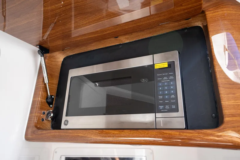 Slide: The Image of Built-in microwave in Deep Impact 499 Sport Luxury Edition, 2026 model, with wood finish. - 61