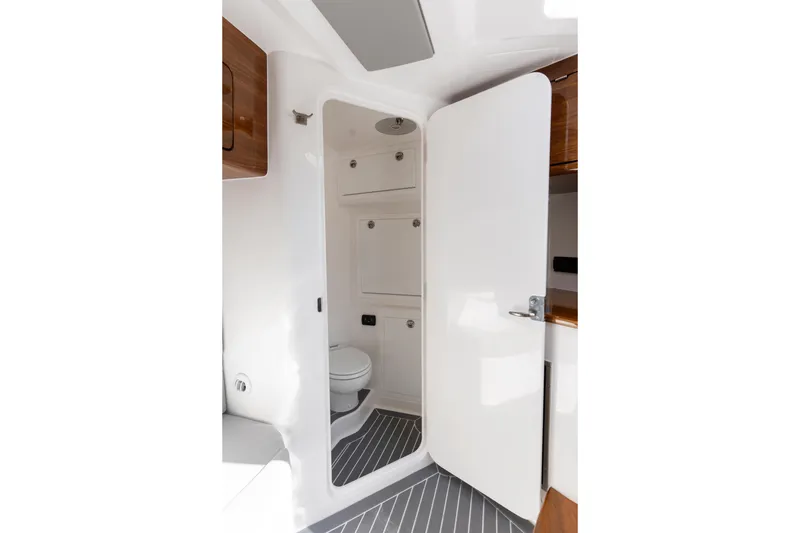 Slide: The Image of Luxurious bathroom interior of 2026 Deep Impact 499 Sport Luxury Edition boat. - 64