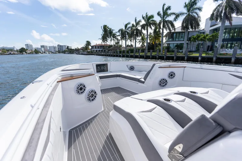 Slide: The Image of Luxury boat interior of 2026 Deep Impact 499 Sport, featuring sleek seating and waterfront view. - 71