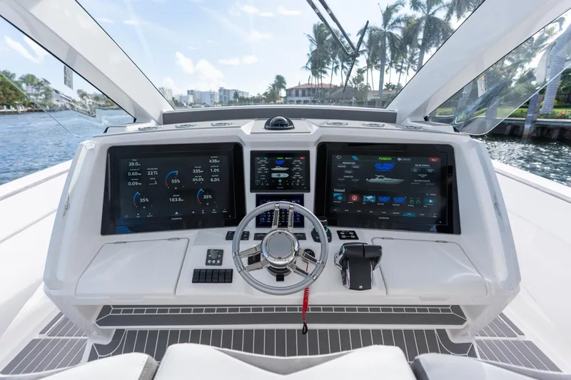 Slide: The Image of Helm of 2026 Deep Impact 499 Sport Luxury Edition with advanced navigation displays. - 73